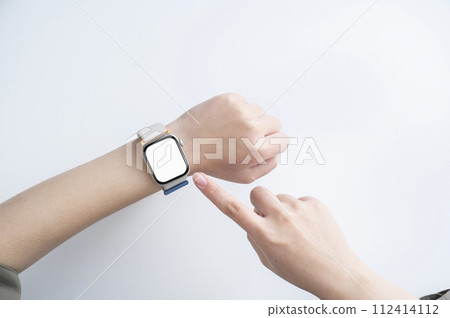 Woman's hand wearing a smartwatch 112414112