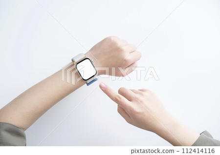 Woman's hand wearing a smartwatch Woman's hand wearing a smartwatch 112414116