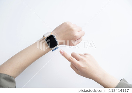 Woman's hand wearing a smartwatch Woman's hand wearing a smartwatch 112414117