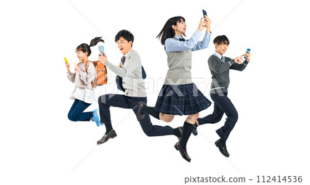 A group of students jumping while using smartphones. Full-body photo PNG with a transparent background precisely cut out by hand. A group of students jumping while using smartphones. Full-body photo PNG with a transparent background precisely cut out by hand. 112414536