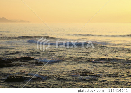 Sunset seen from Goshiki Beach at sunset over Ura Sunset seen from Goshiki Beach at sunset over Ura 112414941