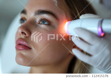 Head of young woman during skin treatment at aesthetic center Head of young woman during skin treatment at aesthetic center 112415176