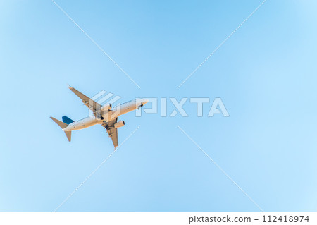 Airplane before landing in blue sky, Boeing 737-800 Airplane before landing in blue sky, Boeing 737-800 112418974