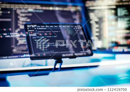 Work from home. Programmer coding code on notebook screen at home. Work from home. Programmer coding code on notebook screen at home. 112419700