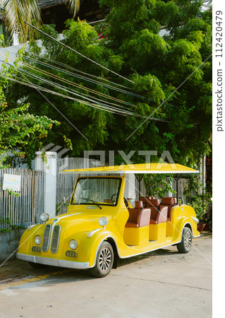 yellow car on the beach 112420479