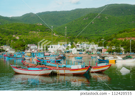 fishing boats on the shore, moored boats 112420555