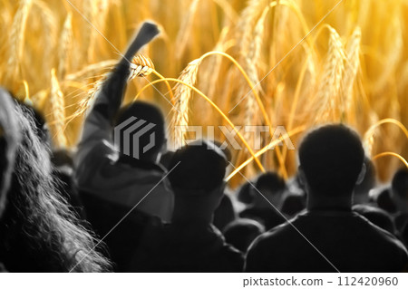 Farmers protest concept. Crowd of people on wheat background. Farmers' protests in Europe and world Farmers protest concept. Crowd of people on wheat background. Farmers' protests in Europe and world 112420960