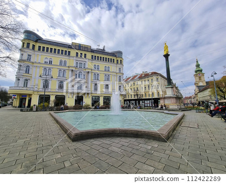 Graz, Austria - 26.03.2023: Mary's Column and fountain in Jakominiplatz Square, famous attraction in the city center of Graz, Steiermark region, Austria. 112422289