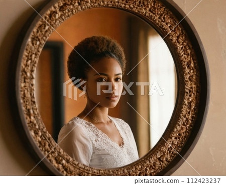 African woman in the reflection of the mirror. 112423237