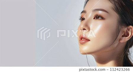 Young Asian woman portrait showcasing her skin care with a a copy space background Young Asian woman portrait showcasing her skin care with a a copy space background 112423266