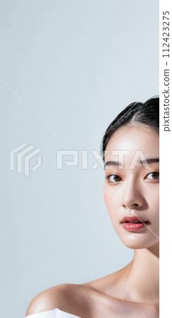 Young Asian woman portrait showcasing her skin care with a a copy space background 112423275