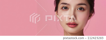 Young Asian woman portrait showcasing her skin care with a a copy space background 112423283