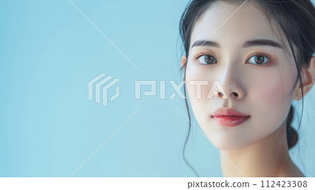 Young Asian woman portrait showcasing her skin care with a a copy space background Young Asian woman portrait showcasing her skin care with a a copy space background 112423308