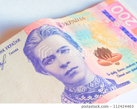Ukrainian currency, 200 UAH, with a blanked out portrait and visible security features. 112424463
