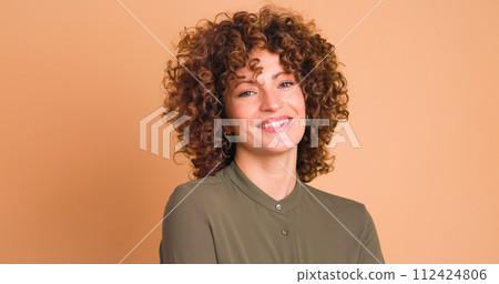 Smiling woman on beige background 112424806