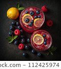 Top view of fresh lemonade with fruits and berries. AI generated. 112425974