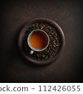 Top view of cup of black tea on a brown table. AI generated. 112426055