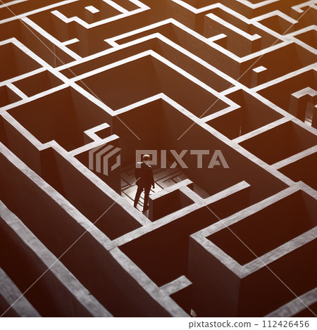 Silhouette of businessman wondering through large maze labyrinth 112426456