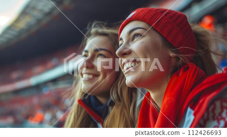 Two beautiful women watching sports 112426693