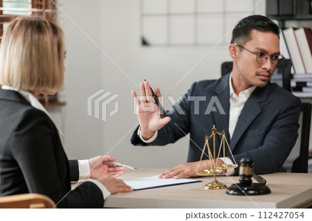 Business and Male lawyers or judge consult having team meetings with clients, Law, and Legal services concept. Customer service good cooperation in office. Business and Male lawyers or judge consult having team meetings with clients, Law, and Legal services concept. Customer service good cooperation in office. 112427054