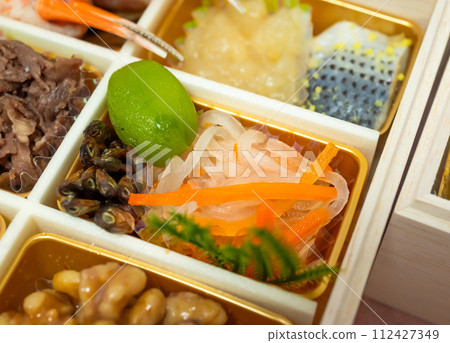 Candied green plums served in seasonal dishes Candied green plums served in seasonal dishes 112427349