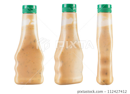 Set of three bottles of cream sauce. Isolated on white background. Set of three bottles of cream sauce. Isolated on white background. 112427412
