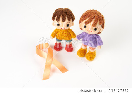 Amigurumi doll orange ribbon 112427882