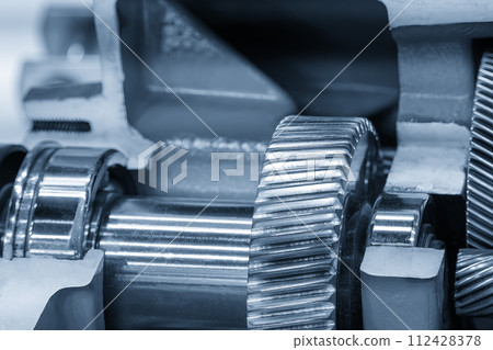 Close up scene the transmission gear parts in the light blue scene. Close up scene the transmission gear parts in the light blue scene. 112428378
