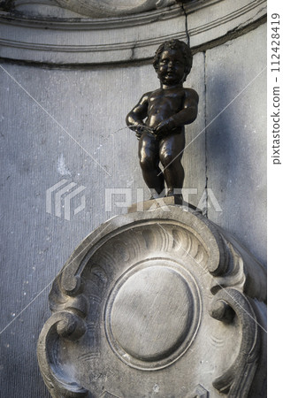 Brussels - Belgium - 3 March 2024 - view of the famous manneken pis statue on the fountain 112428419