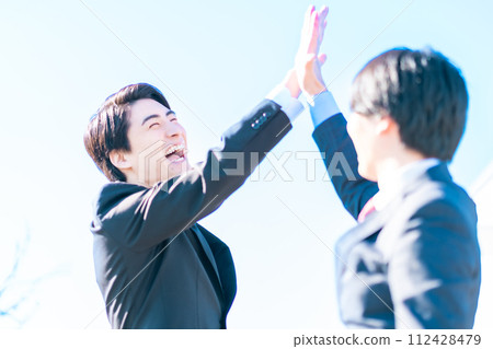 Businessmen praising each other for good fights with high five Businessmen praising each other for good fights with high five 112428479