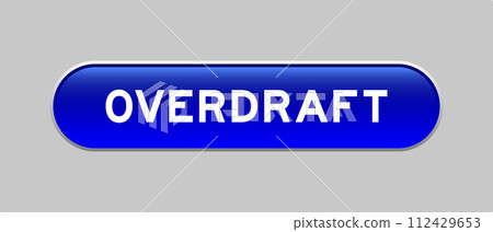 Blue color capsule shape button with word overdraft on gray background 112429653