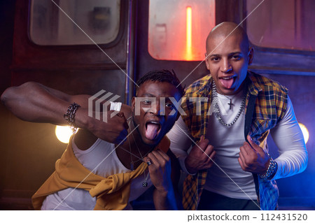 Two emotional guys performing hip-hop style in underground 112431520