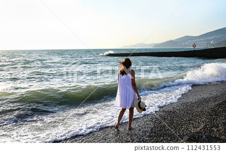 Young woman floating on water in swimming pool 112431553
