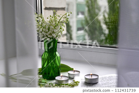 Composition of lily of the valley. Spring concept. A gift to a woman. Composition of lily of the valley. Spring concept. A gift to a woman. 112431739