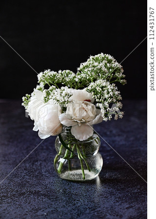 Fresh white peonies on a black, dark background. A condolence card. Wedding date. An invitation to a holiday. Congratulation.An empty space for text. View from above. He was lying flat. Fresh white peonies on a black, dark background. A condolence card. Wedding date. An invitation to a holiday. Congratulation.An empty space for text. View from above. He was lying flat. 112431767