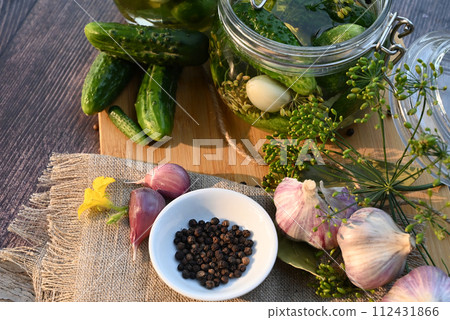 a set of ingredients for pickling cucumbers, pickled cucumbers, brine. a set of ingredients for pickling cucumbers, pickled cucumbers, brine. 112431866