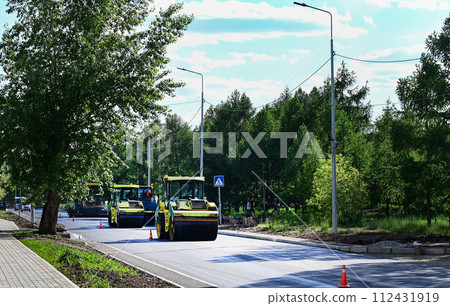 Large view on the road rollers working on the new road construction site 112431919