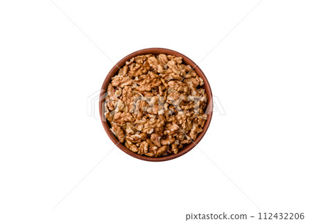 Delicious fresh peeled raw walnuts in a ceramic plate Delicious fresh peeled raw walnuts in a ceramic plate 112432206