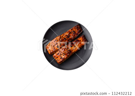 Delicious red salmon fish grilled with sauce and sesame, spices and herbs Delicious red salmon fish grilled with sauce and sesame, spices and herbs 112432212