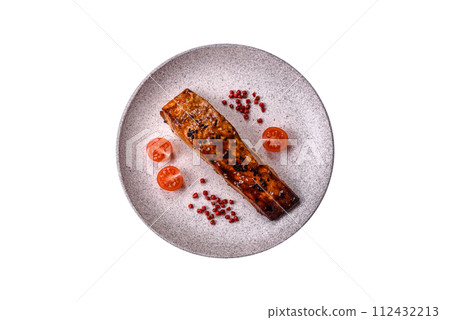 Delicious red salmon fish grilled with sauce and sesame, spices and herbs 112432213