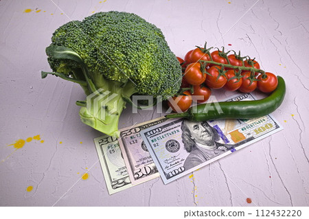 Vegetables have gone up in price. Grey background. 112432220