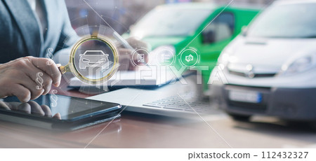 The lawyer checks the car from the legal side. 112432327