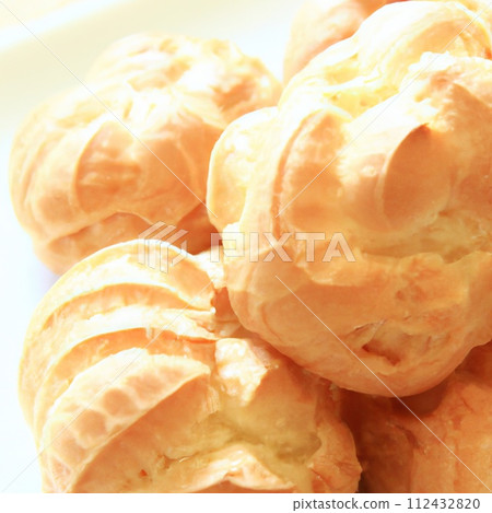 Eclair is a traditional french crispy dessert with buttercream. AI generated. Eclair is a traditional french crispy dessert with buttercream. AI generated. 112432820