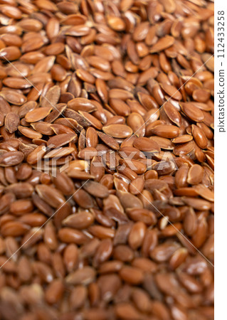 Macro set of flax seeds close-up vertical Macro set of flax seeds close-up vertical 112433258