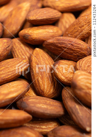 A lot of roasted nuts almond macro A lot of roasted nuts almond macro 112433264