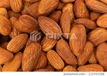 A lot of roasted nuts almond macro A lot of roasted nuts almond macro 112433266