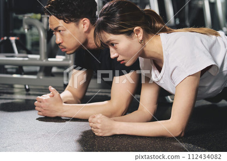 Young male personal trainer with a serious expression at the training gym Young male personal trainer with a serious expression at the training gym 112434082