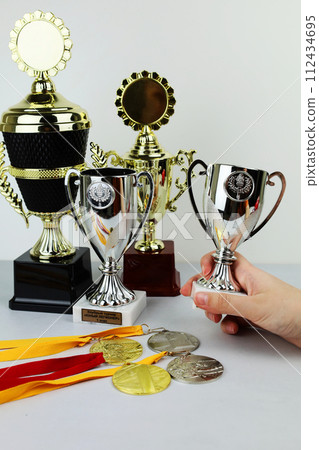 cups and medals for awarding the winners. Sports, competitions. 112434695