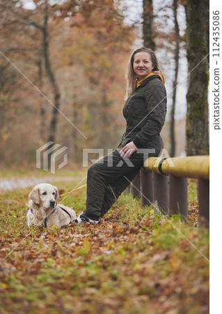 Charming woman walking in the forest in Denmark Charming woman walking in the forest in Denmark 112435086