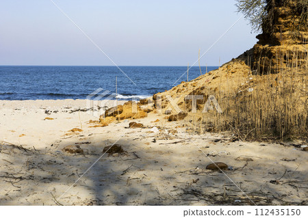 View of the beautiful landscape with the beach and sand dunes, the landscape of the coast. View of the beautiful landscape with the beach and sand dunes, the landscape of the coast. 112435150